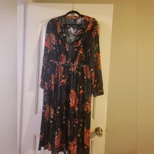 colorful large paisley on a black backround, this dress is a size 1.